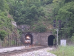 WB coal train pops out of the tunnel